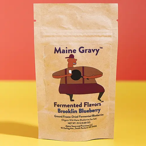 Fermented Flavors Brooklin Blueberry seasoning pouch on a colored background